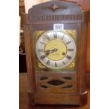 An oak cased mantel clock.