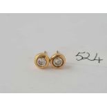 Pair of 9ct white stone stud earrings