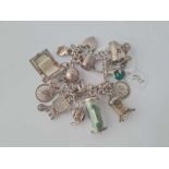 A heavy silver charm bracelet 66g