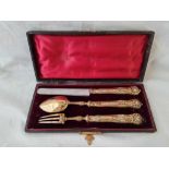 A 19th Century French silver gilt Christening set, decorated with scrolls, fitted case