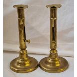 A pair of Georgian brass candlesticks with extinguishers - 8" high