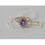 A purple and white stone ring 9ct size P