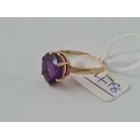 A purple stone ring 9ctsize T - 2.3 gms