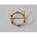 a antique Victorian sapphire and pearl set circular brooch set in 15ct gold