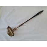 A large ladle with turned wood handle - continental dated 1856
