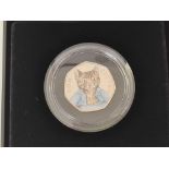 A boxed silver Royal Mint Beatrix Potter 50p with paperwork. Tom Kitten