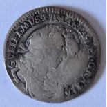 A William and Mary sixpence 1693 (bent)