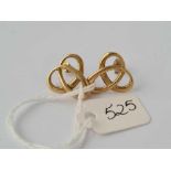 A pair of large 9ct swirl earrings 3.3g