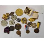 A bag of commemorative medals, badges etc