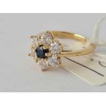A blue stone cluster ring 9ct size H1/2 - 2.5 gms