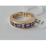 A heavy Tanzanite and diamond half hoop 14ct gold ring size P 5.8g inc