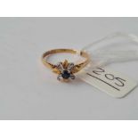A diamond and sapphire ring 18ct gold size o - 2.1 gms