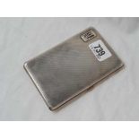 An engine turned cigarette case with 9ct gold mounts, total weight 210g