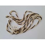 A deco opera length white and black pearl twist necklace