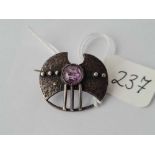 A small arts & crafts amethyst silver brooch