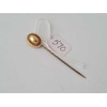 A gold top stick pin