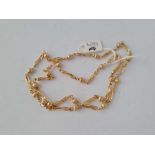 A FANCY LINK NECK CHAIN 9CT 22 INCHES - 15.8 GMS