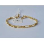 A MODERN STYLE ELEVEN CLUSTER DIAMOND BRACELET 14CT GOLD 6 3/4 INCHES LONG - 8 GMS