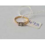 A small three stone diamond ring 18ct gold size K - 1.6 gms