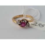 A three stone ruby & diamond 18ct gold ring size Q 4.3g inc