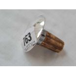 A silver mounted bottle stopper - marked STERLING by FS