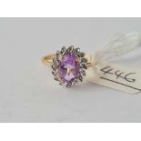 A oval amethyst and diamond cluster ring 9ct size P - 2.3 gms