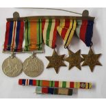 A group of 5 WWII medals on a bar