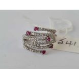 A 9ct white gold six tier stone set and ruby ring (one ruby missing) size J - 3.5 gms over 1/2 carat