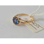 A blue stone dress ring 9ct size o - 1.5 gms