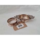 A two handled tea strainer - Birmingham 1917 and a napkin ring