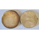 Two foreign silver coins 46 g.