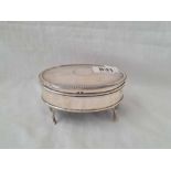 An oval jewellery box standing on four pad feet - 4" wide - Birmingham 1921