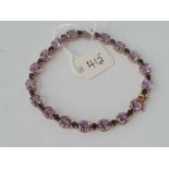 A ATTRACTIVE TOURMALINE/ AMETHYST AND SAPPHIRE LINE BRACELET 9CT - 8.8 GMS