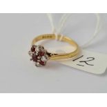 A diamond & garnet 18ct gold flower head ring (stone out)size M 3.2g inc