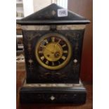 A marble cased Victorian mantel clock. 17" high.