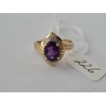 An amethyst set 9ct ring with diamond shoulders size N