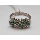 An emerald & diamond flower cluster ring in 18ct gold size N 4.3g inc