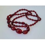 A long faceted amber bead necklace 58g