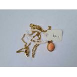 An oval single stone coral drop pendant set in 9ct on a neck chain