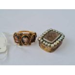 A antique gold ring with two panels (one missing) and a brooch centre with hair and pearls