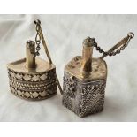 Two Eastern silver scent bottles with chased decoration - 3" high - 88g.