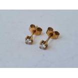 A pair of mounted diamond earrings 9ct
