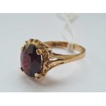 A vintage dress ring with large deep red stone 9ct size O - 3.8 gms