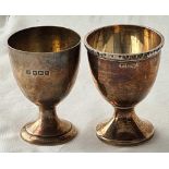 Two plain egg cups on spreading bases - 2.25" high - Sheffield 1919/32 - 71 g.