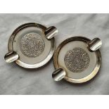 A pair of sterling silver ash trays - 3.5" wide - 44 g.