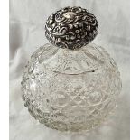 A cut glass scent bottle with embossed cover - London 1902