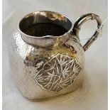 A Chinese silver small jug, the bamboo effect handle at right angles to the spout - 3" wide - 74 g.