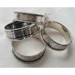 A pair of beaded edge napkin rings - Birmingham 1899 and two other similar