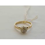 A antique diamond cluster ring 18ct gold size K