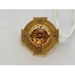A enamelled Scottish brooch set with central citrine 15ct gold